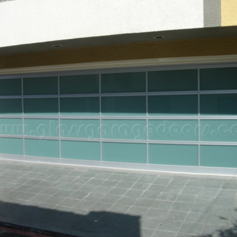 Modern bp Glass Garage Door in Hermosa Beach California garage with clear anodized aluminum frame design