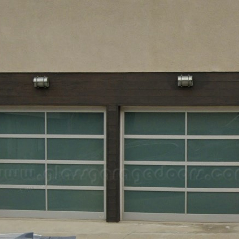 Stylish and modern duo of bp Glass Garage Door with full glass panels in Playa del Rey California home