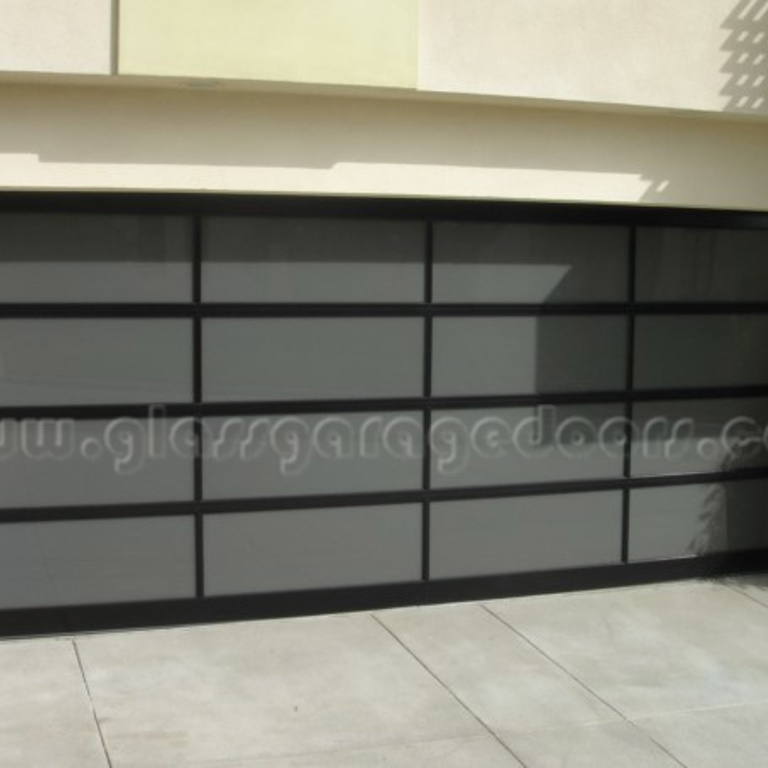 Full-view bp glass garage door with dark tinted panels and sleek black frames, providing privacy and a sophisticated modern aesthetic for residential properties 
