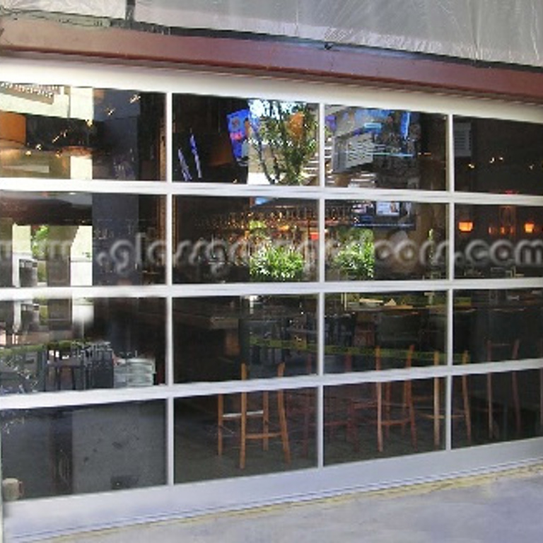Full-view bp Glass Garage Door, enhancing natural light in a Tampa, Florida restaurant