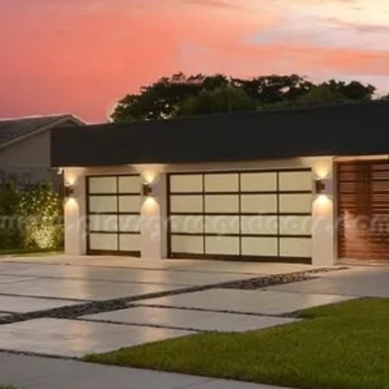 Modern bp Glass Garage Door with dark frame and gray glass in Boca Raton, Florida