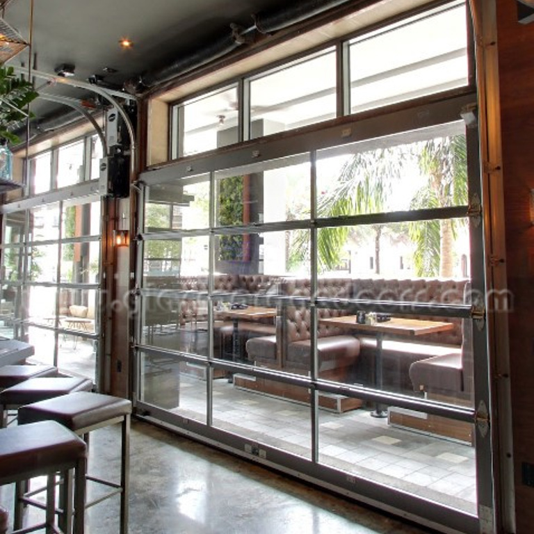 bp Glass Garage Doors Dividing Indoor  &Outdoor Dining Space: Highlights the core subject and function.