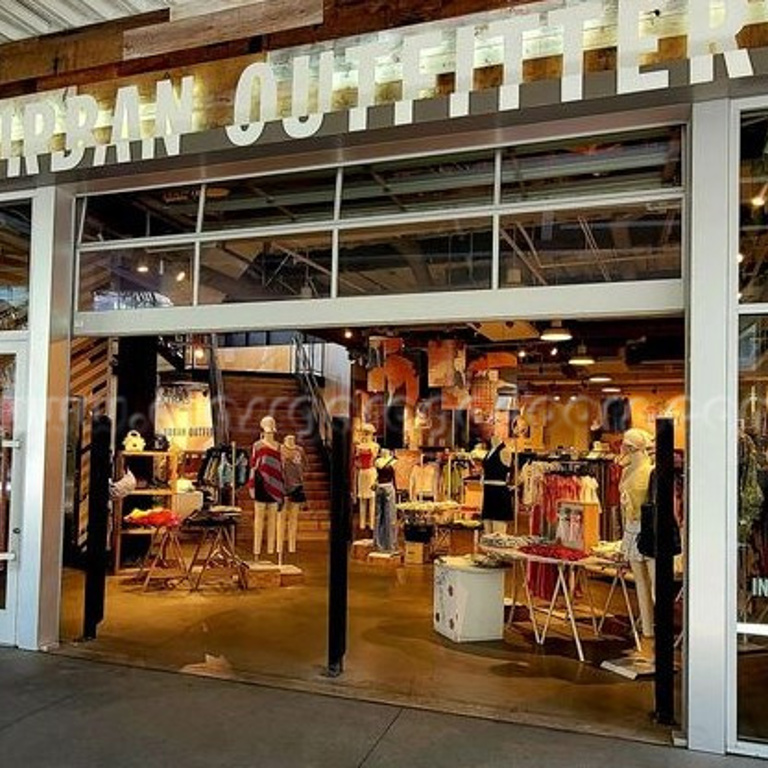 Full-view bp Glass Garage Door in Huntington Beach fashion store offering visibility and a modern look